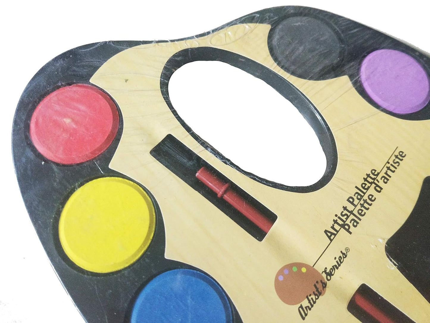 Watercolor paint palette with brush