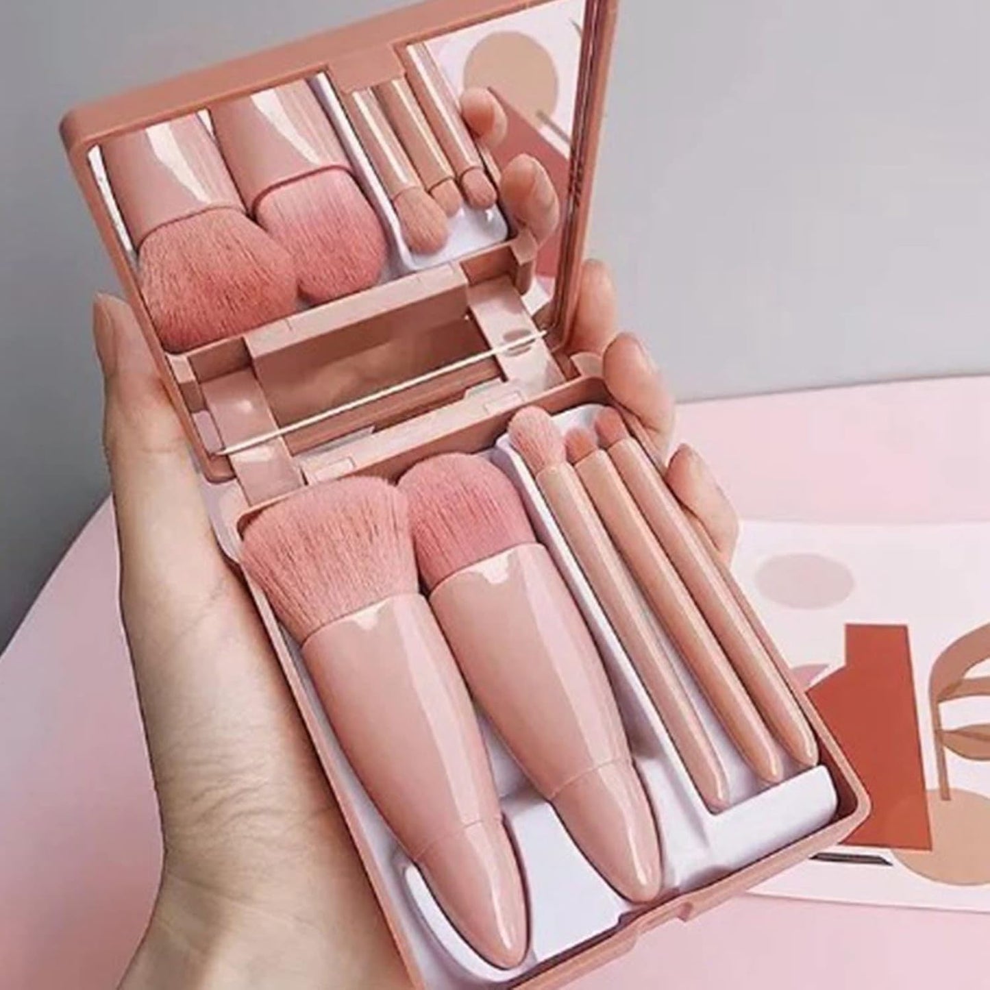 Cosmetic mirror with brushes